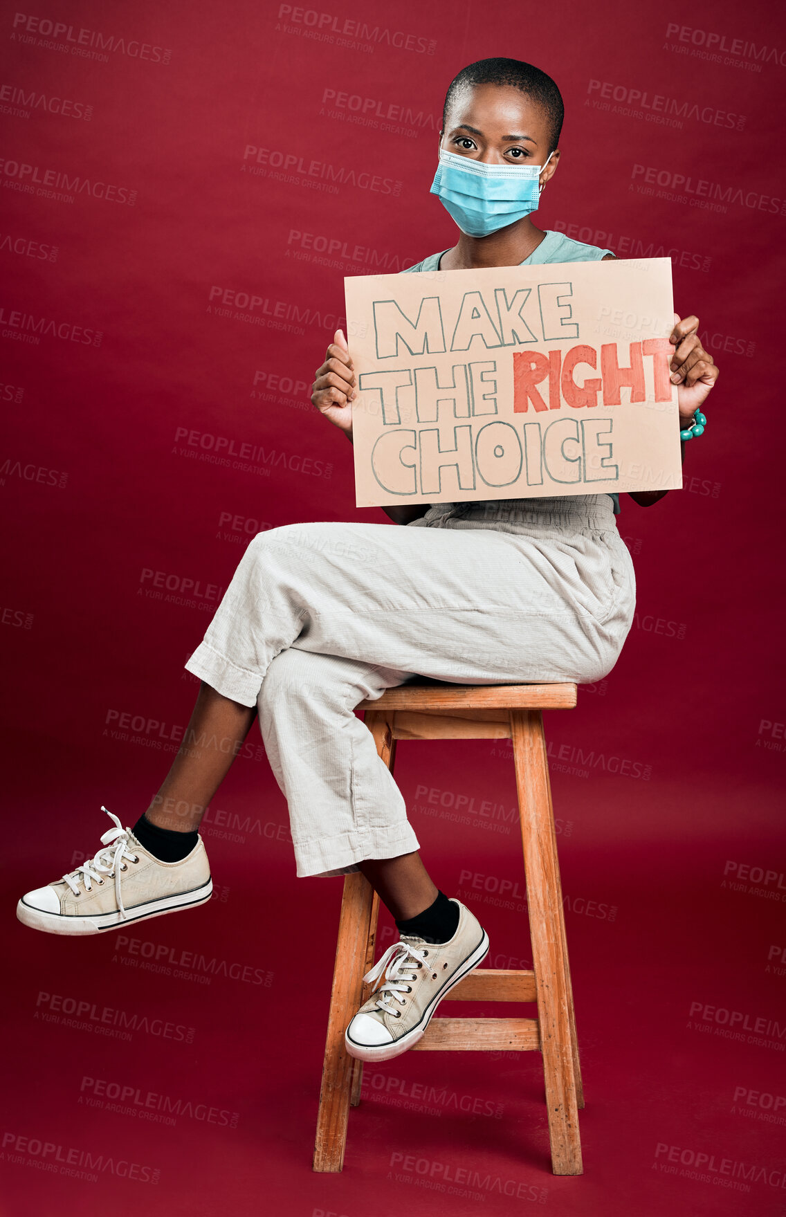 Buy stock photo Portrait, face mask and placard with black woman in studio for protest, human rights activist and healthcare choice. Freedom of speech, safety and mpox virus with person and poster on red background 