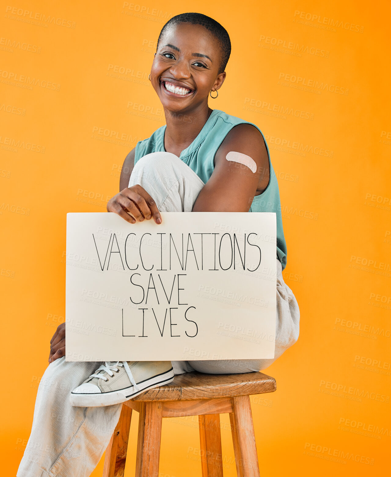 Buy stock photo Poster, plaster and smile with portrait of black woman in studio on background for healthcare or medical. Happy, pandemic and vaccination saves lives sign with person for support or wellness