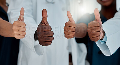 Buy stock photo Doctors, hands and thumbs up in hospital for healthcare, teamwork and support vote. People, medical group and like emoji in clinic for approval, opinion and trust for advice with health agreement