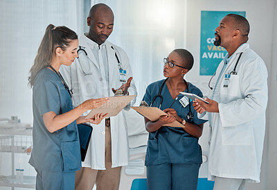 Buy stock photo Clipboard, doctors and nurses meeting in hospital for healthcare or medical collaboration. Conversation, technology or writing with man and woman medicine professional group in clinic for teamwork