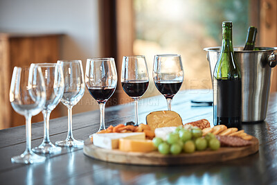 Buy stock photo Wine tasting, glasses and cheese board at vineyard with drinks, bottle and fine dining. Party, celebration or pairing event with platter, food and fruit on table at winery with alcohol and liquid