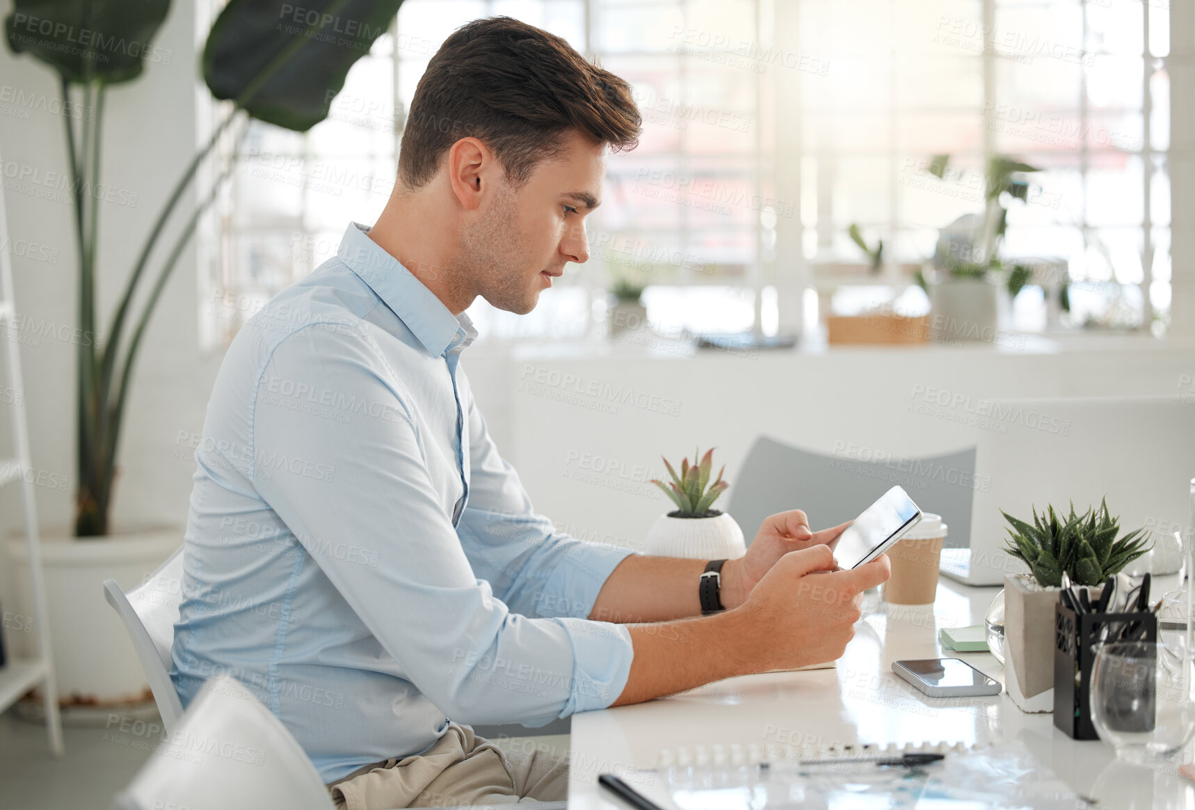 Buy stock photo Creative, design and tablet with business man at desk in office for development, planning or research. Agency, reading and technology with editor, illustrator or publisher in workplace for report