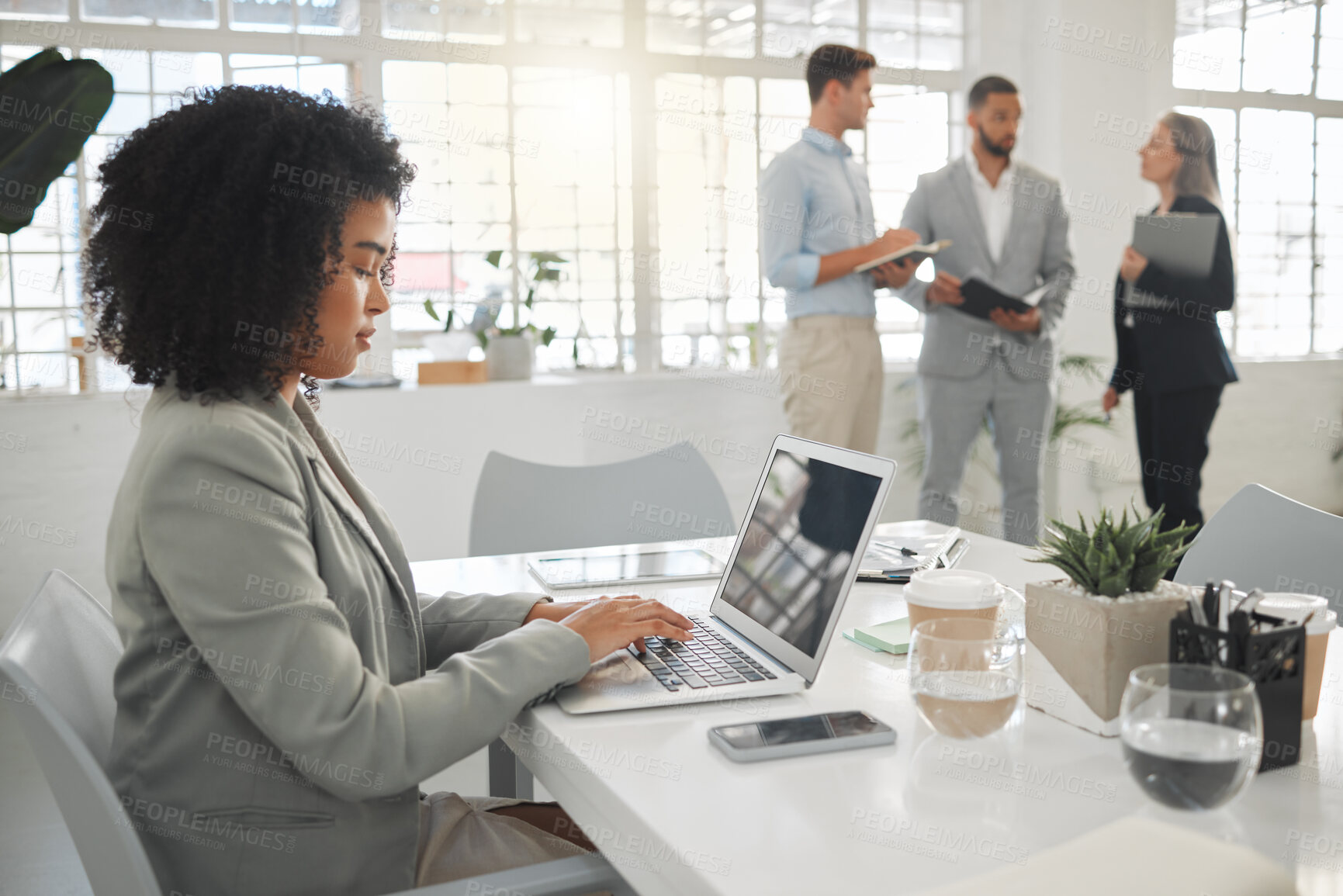 Buy stock photo Coworking, laptop and typing with business people in office for meeting, project or research. Computer, design and development with employee at desk in workplace for online feedback or reporting