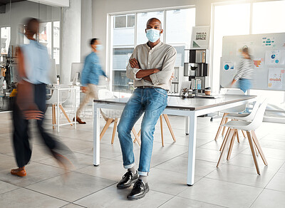 Buy stock photo Portrait, mask and confident businessman in busy office, creative startup and social media data analyst. Arms crossed, blur and work in company with ppe for health, virus safety and covid protection