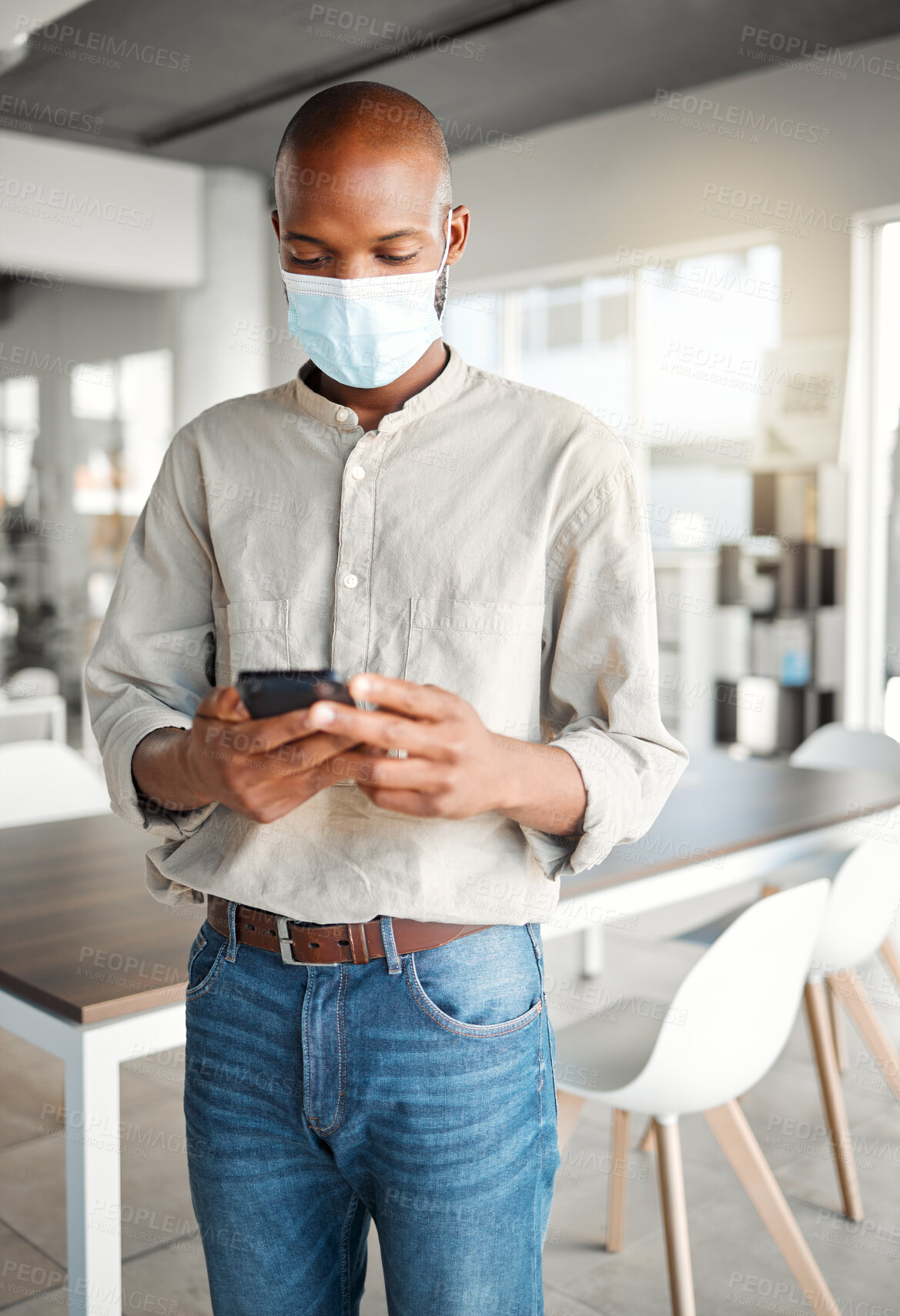 Buy stock photo Black man, phone and reading in office with mask, connectivity and Covid 19 news update. Business person, PPE and mobile in workplace for notification, social media and schedule app for planning