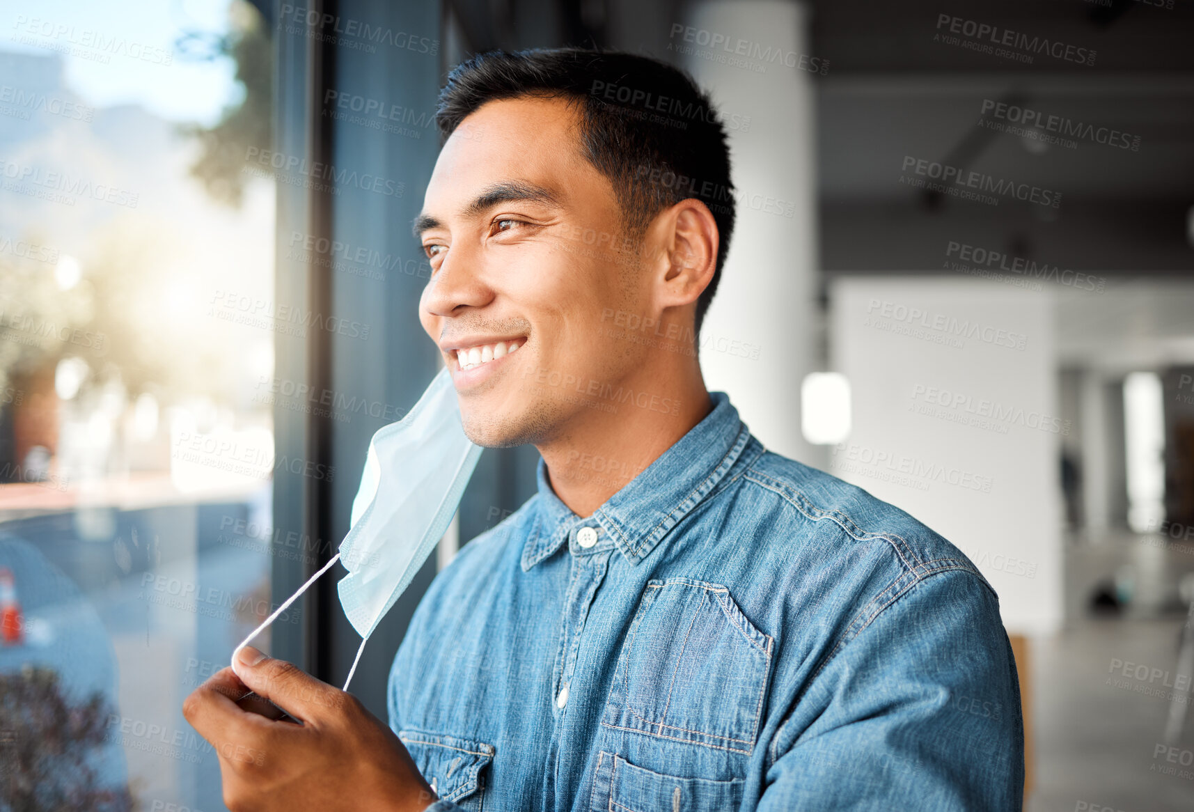 Buy stock photo Asian man, smile and removing face mask for public health, pandemic and wellness as relief or safety. Male person, protection and illness prevention in office for communication, comfort and hygiene