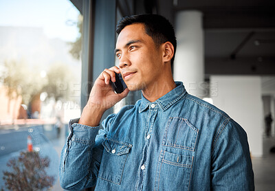 Buy stock photo Phone call, Asian man and conversation in office, window and communication with contact and serious. Creative, art director and discussion for project, person and mobile for business and digital