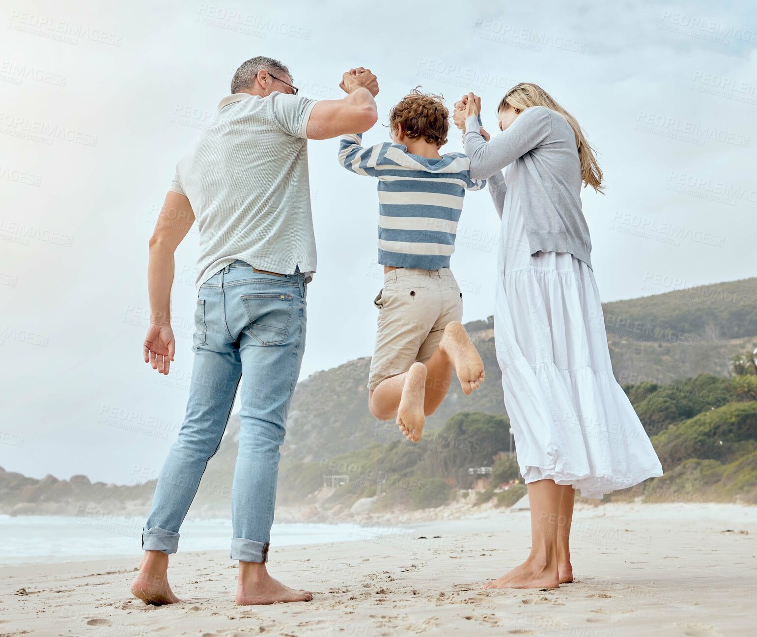 Buy stock photo Happy, beach and child swing by parents with fun game and family with happy, travel and student holiday. Sea, back and lift together with love, security and support with playing and youth by ocean