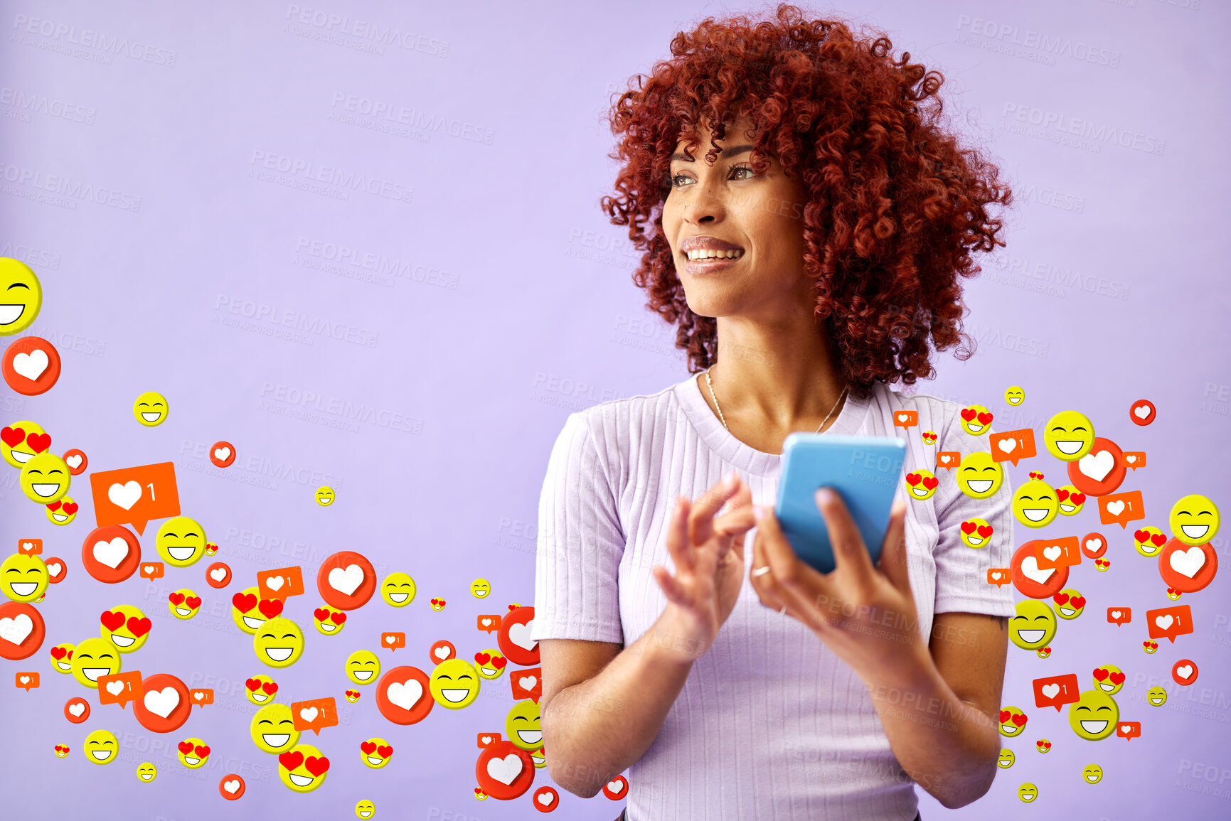 Buy stock photo Phone, social media and emoji notification with a black woman in studio on a purple background for communication. Mobile, app and reaction with a happy young person using technology to like a post