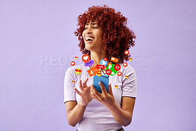 Buy stock photo Phone, social media and emoji reaction with a black woman in studio on a purple background for communication. Mobile, app and notification with a happy young person using technology to like a post