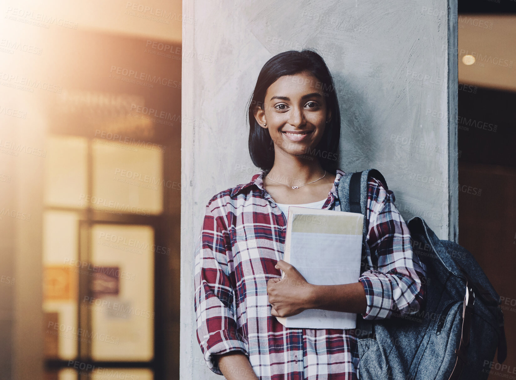 Buy stock photo Indian girl, student and portrait on campus with book for learning, studying and education at university. Person, happy and backpack with novel for exam information, college scholarship and knowledge