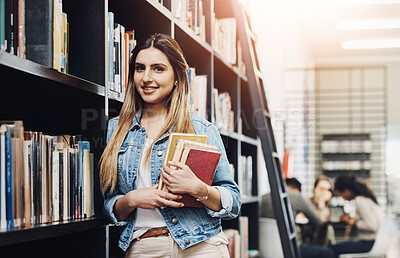 Buy stock photo Girl, university student and bookshelf in library for portrait, smile or learning for development at academy. Woman, books and happy with research, scholarship and education at college hall in Canada