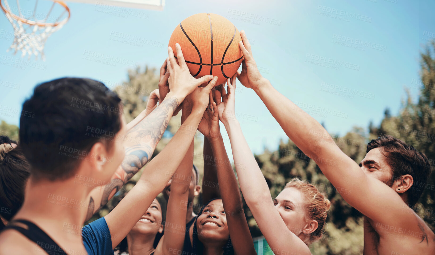 Buy stock photo Outdoor, people and happy on synergy with basketball at court for sports, match and tournament. Teammates, players and smile or satisfied with unity, solidarity and support for teamwork for games