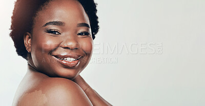 Buy stock photo Black woman, skincare and smile in studio portrait with space for mock up by white background. Girl, model and person with beauty, cosmetics and dermatology with glow, results and happy in Nigeria