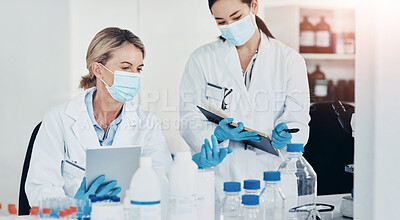 Buy stock photo Women, scientist and discussion in lab with notebook, tablet and review for experiment results at pharma company. People, mentor and feedback with chemical, drugs or medical research for mpox vaccine