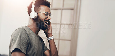 Buy stock photo Headphones, music and happy black man in home listening to audio, streaming song and radio. Entertainment, subscription and person with earphones for album to relax, chill and sing to playlist