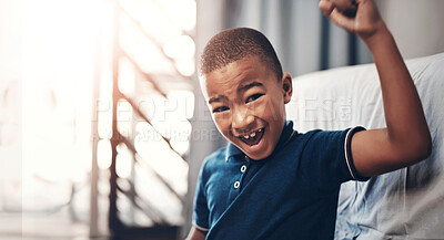 Buy stock photo Success, child and portrait with celebration in home for achievement, winner and shouting with good news. African kid, boy and excited with victory fist in sofa in lounge for triumph and cheering