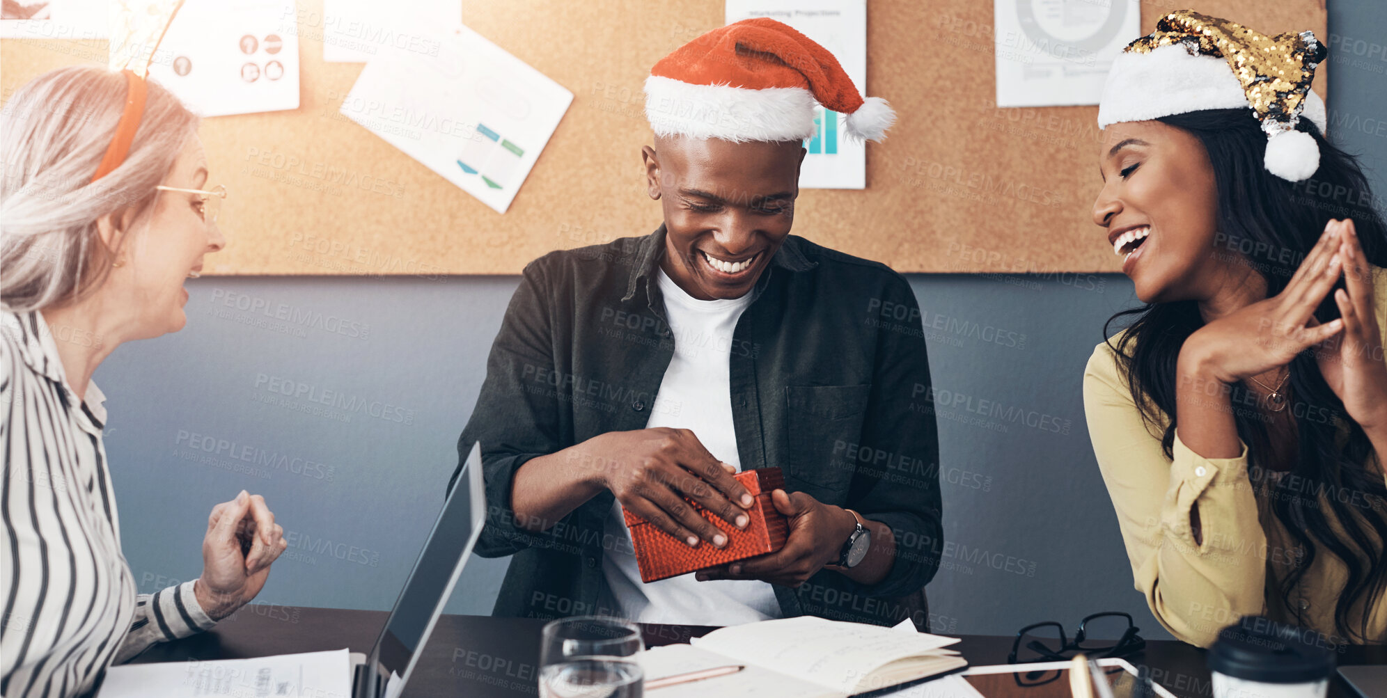 Buy stock photo Christmas, business people and surprise present in office for festive celebration, gift giving or colleague appreciation. Team, employee or excited to open box at desk for secret santa holiday season