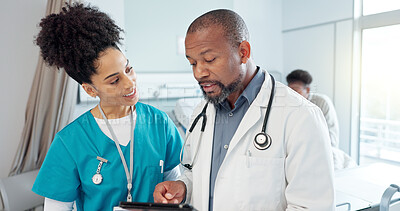 Buy stock photo Discussion, nurse and doctor with tablet, smile and reading of medical research and diagnosis of patient. Hospital, woman and mature man with info, talking and planning for appointment and healthcare