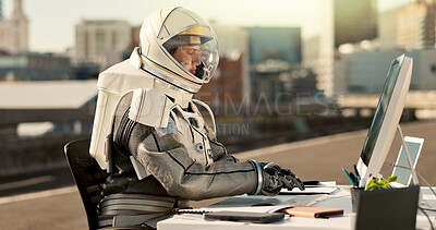 Buy stock photo Typing, city and astronaut with computer in road for business project with interstellar report for mission. Tech, person and space pilot at desk working on discovery of civilization on bridge in town