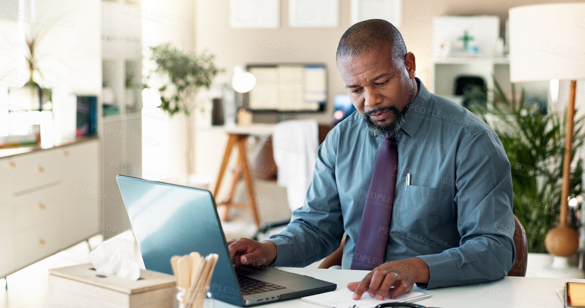 Buy stock photo Reading, typing and man with laptop, healthcare and data entry with health records and information. Digital, documents and black person with app for research, patient navigator and online in hospital