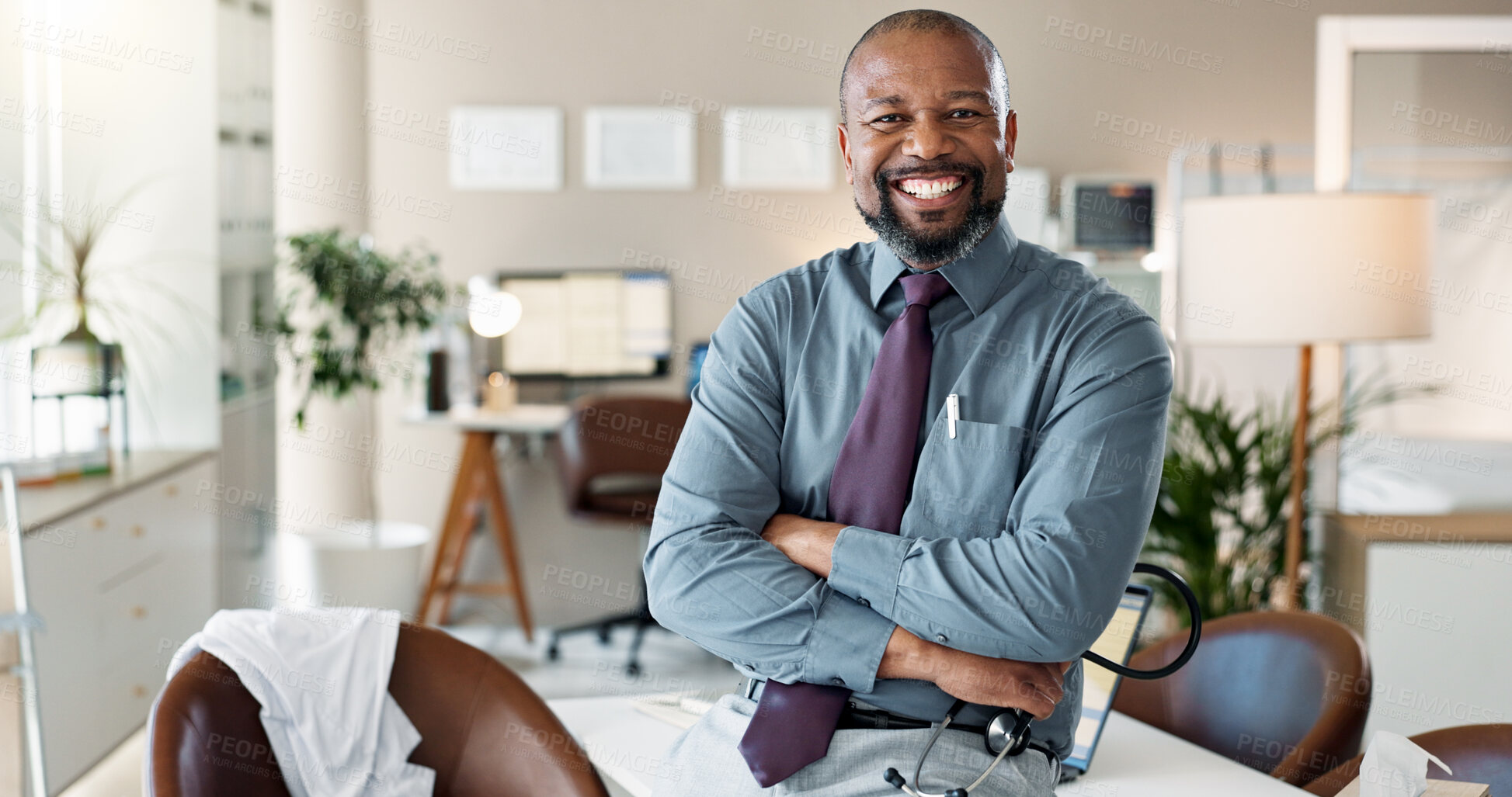 Buy stock photo Black man, doctor and happy with arms crossed on portrait at office for healthcare and support in Kenya. male person, employee and smile as medical professional with pride or confidence at clinic