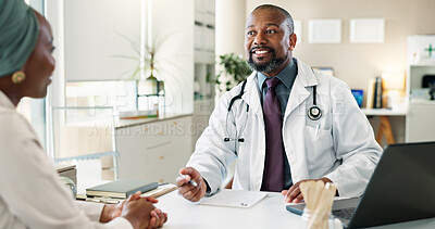 Buy stock photo Discussion, healthcare and laptop with doctor and patient in office at hospital for consulting or feedback. Cpmputer, smile and medical professional man talking to person in clinic for checkup