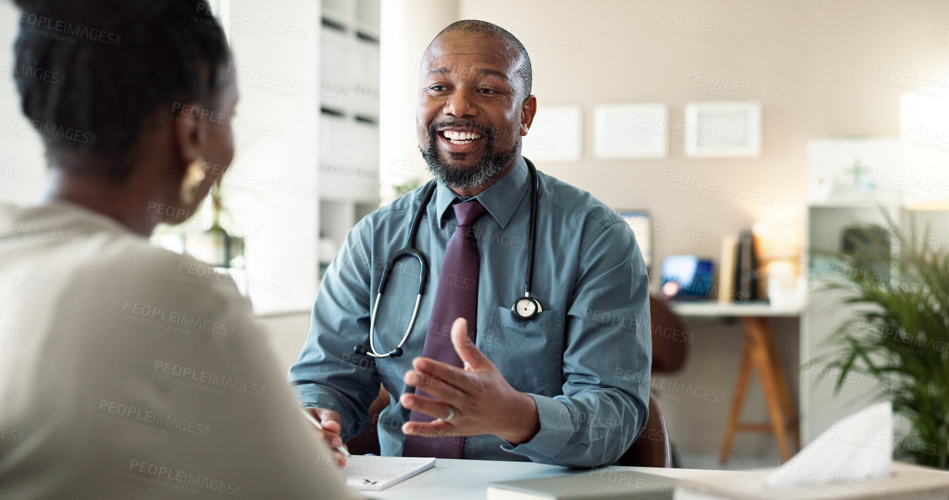 Buy stock photo Conversation, healthcare and smile of doctor with patient in office at hospital for consulting or discussion. Feedback, happy and medical professional black man with person in clinic for checkup