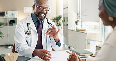 Buy stock photo Healthcare, okay or results with doctor and patient in office at hospital for consulting or positive feedback. Hand gesture, smile and medical professional man talking to person in clinic for checkup