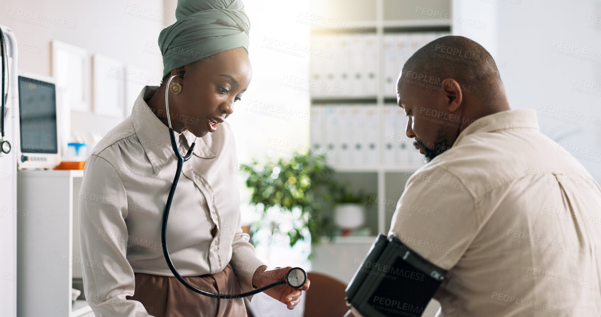 Buy stock photo Doctor, black woman and blood pressure in consultation with patient and hypertension check in clinic. Healthcare, consultant and medical professional with stethoscope and cardiology for wellness