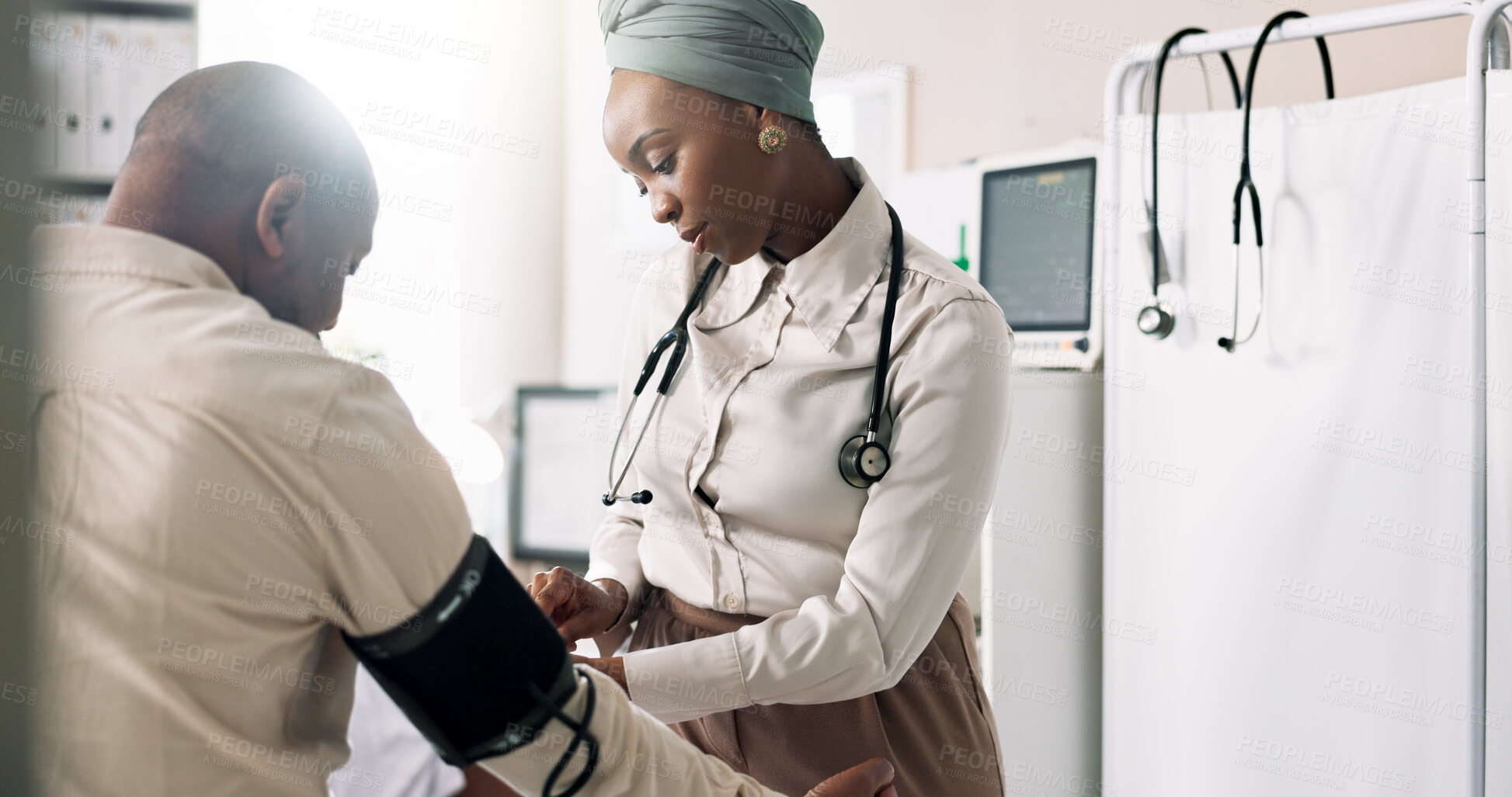 Buy stock photo Doctor, patient and test in hospital for blood pressure, healthcare and stethoscope for examination. Black people, man and procedure in practice for heart health, diabetes diagnosis and assessment