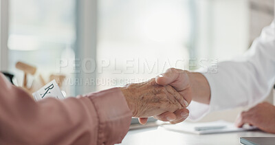 Buy stock photo Handshake, doctor and patient with closeup, support and wellness with stethoscope. Medical, senior person and professional shaking hands, treatment and cure with results, thank you and healthcare