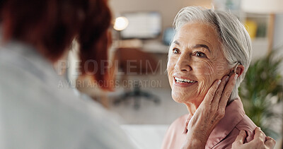 Buy stock photo Doctor, senior woman and hearing aid in clinic for geriatric support, tinnitus and help for sound waves. Ent, otolaryngology and patient with cochlear implant for audio, healthcare and auditory tech 