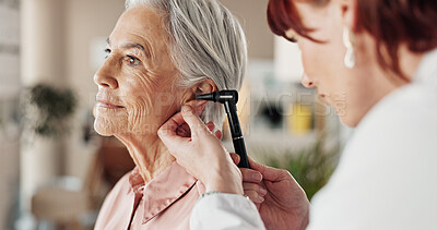 Buy stock photo Senior, woman and doctor with otoscope in clinic for ear screening, wellness exam and audio check. Ent, otolaryngology or medical professional with elderly person in hospital for checkup or infection