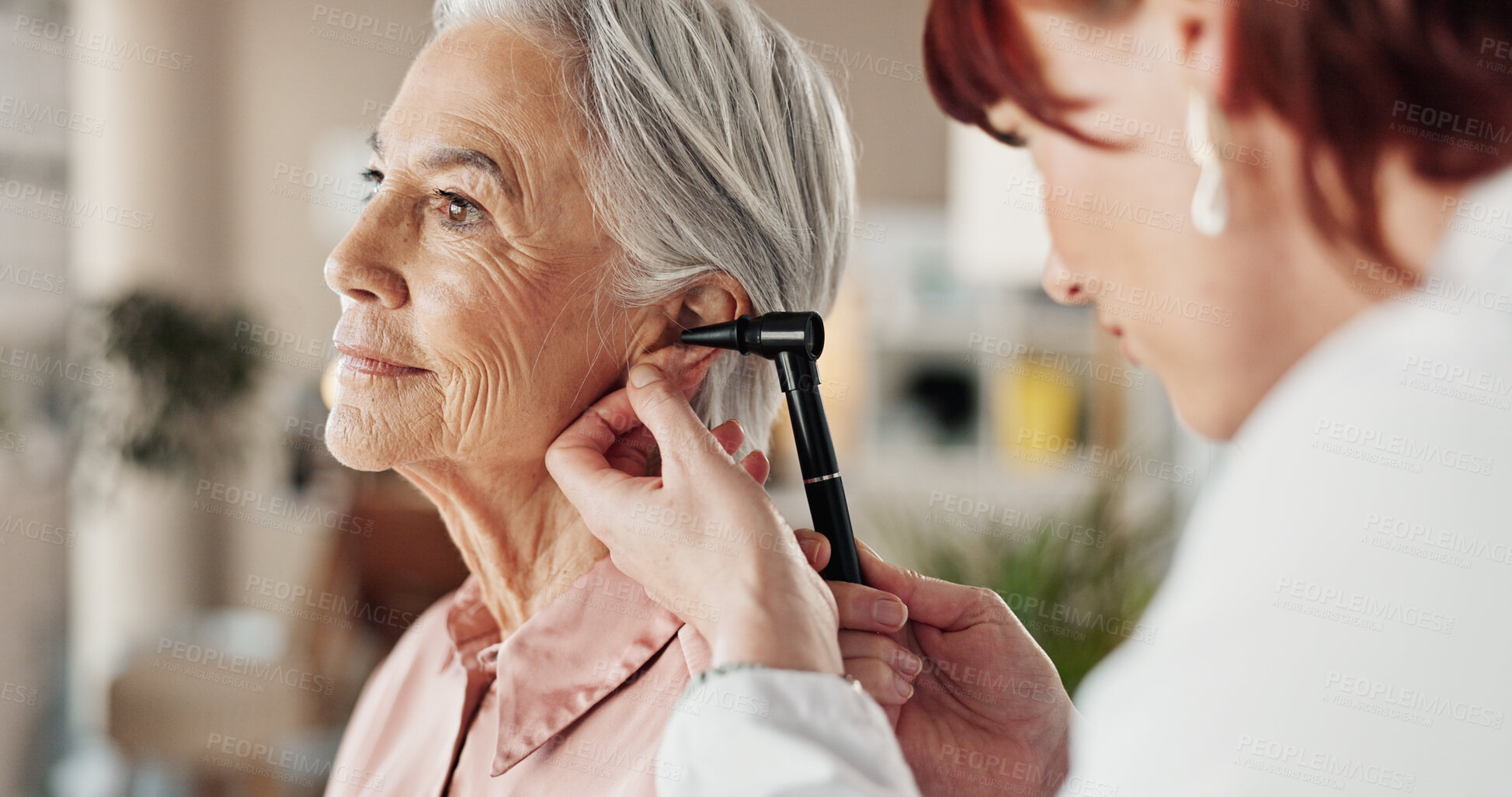 Buy stock photo Senior, woman and doctor with otoscope in clinic for ear screening, wellness exam and audio check. Ent, otolaryngology or medical professional with elderly person in hospital for checkup or infection