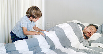 Buy stock photo Boy, bedroom and wakeup father in home for fun, playing and bonding on break. People, apartment and sleeping in bed to rest with kid for games, relax and care as parent with son for family support 