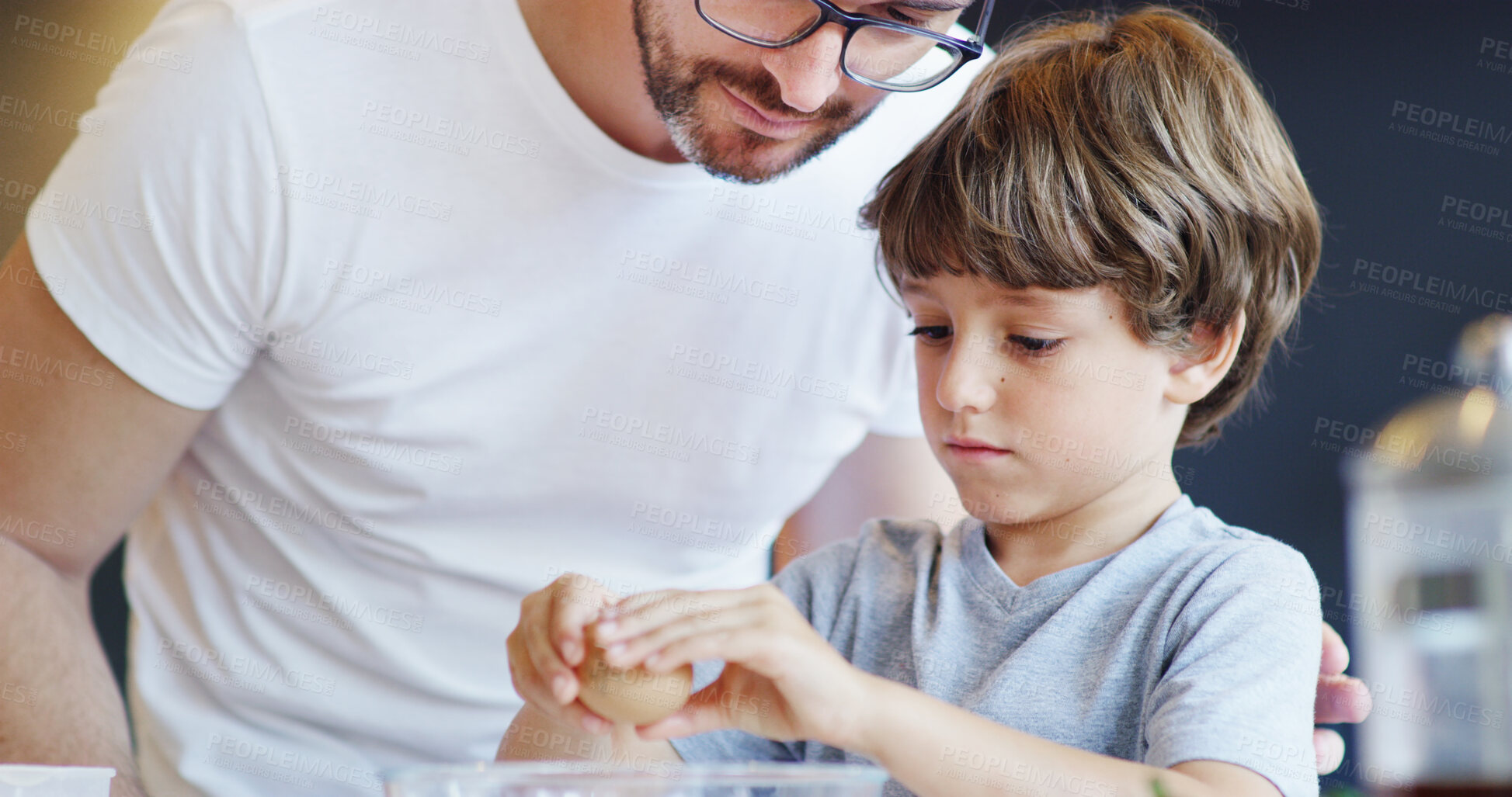 Buy stock photo Father, child and cracking eggs for baking with creativity for food, nutrition and diet in home. Young boy, hungry and man in cooking breakfast for education as meal prep with ingredients in kitchen
