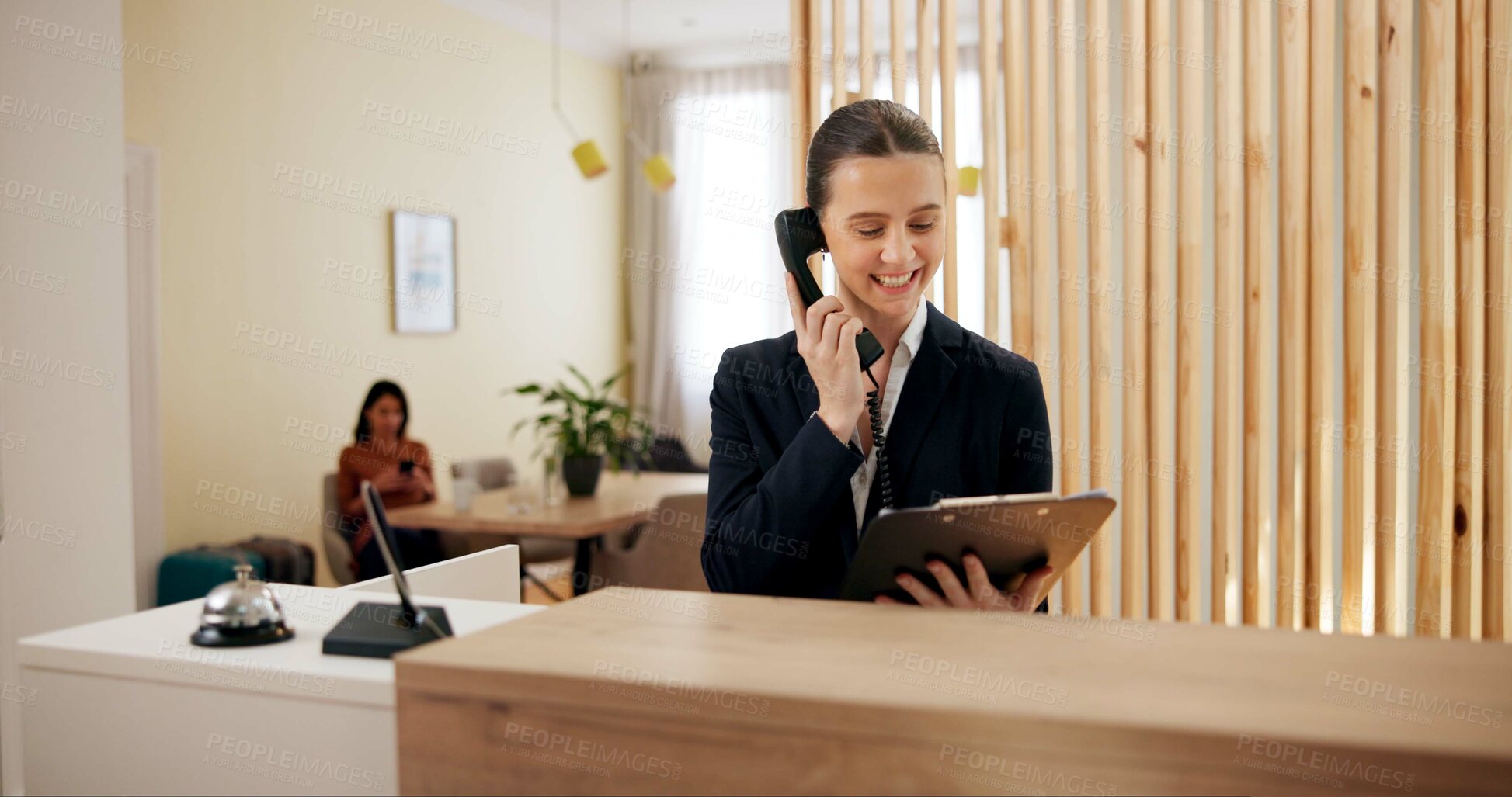 Buy stock photo Clipboard, woman and receptionist in hotel with telephone, schedule booking and checklist on counter. Help desk, hospitality and concierge with calling for customer service, assistance or reservation