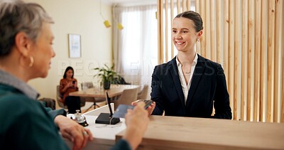 Buy stock photo Hotel, woman and customer at reception with credit card, online banking or smile for luxury service. Payment, receptionist and mature client at desk with pos, hospitality or happy check in at counter