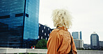 Back view, thinking or woman in city with urban fashion or trendy coat outside in New York. Ideas, skyscraper or creative female designer walking in street for holiday travel, commute or sightseeing