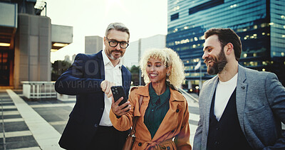 Buy stock photo App launch, city and friends with phone, together for communication, networking or social media. Business, funny or meme with colleague man and woman group outdoor in urban town for humor or joking