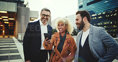 Buy stock photo City, business and friends laughing at phone together for communication, networking or social media. App, funny or meme with colleague man and woman group outdoor in urban town for humor or joking