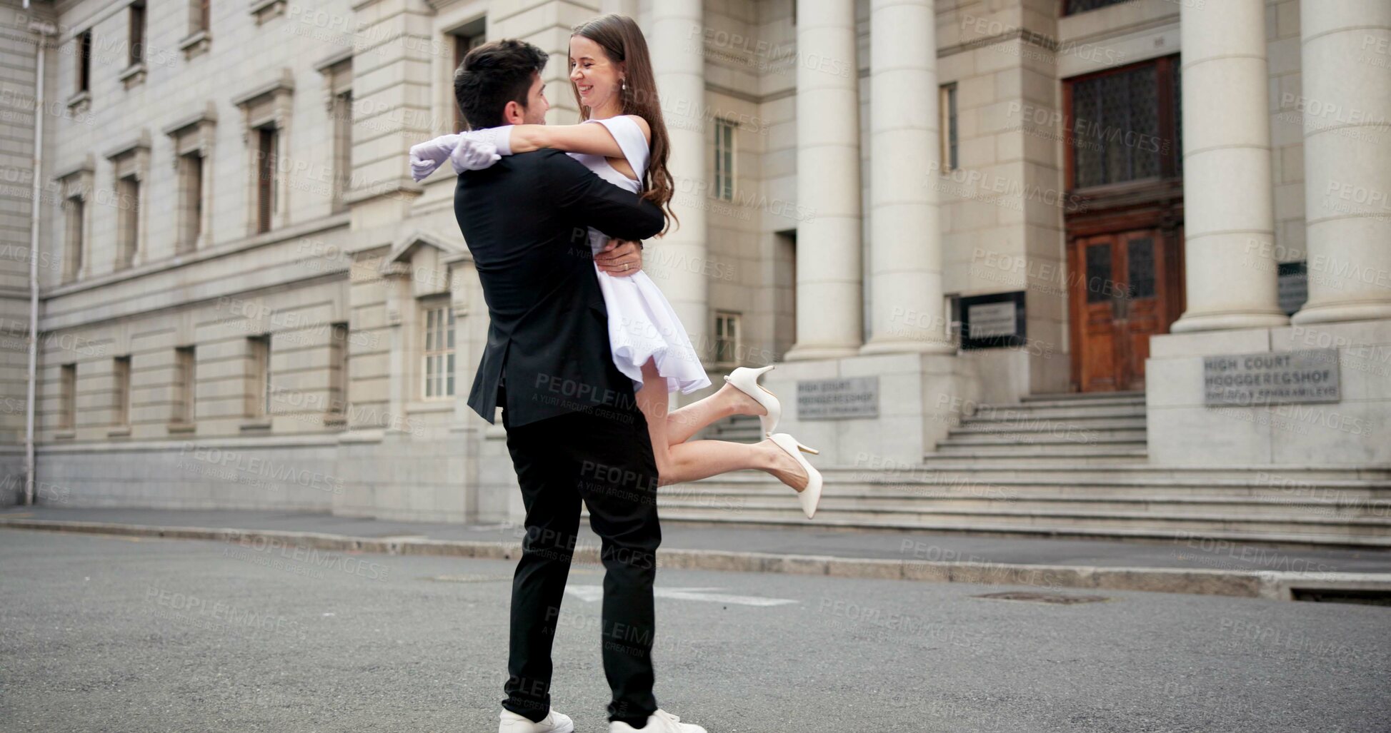 Buy stock photo Wedding, carry and couple in city for spin at marriage ceremony, celebration and court certificate. Romance, bride and groom and happy man and woman in town for commitment, partnership and promise