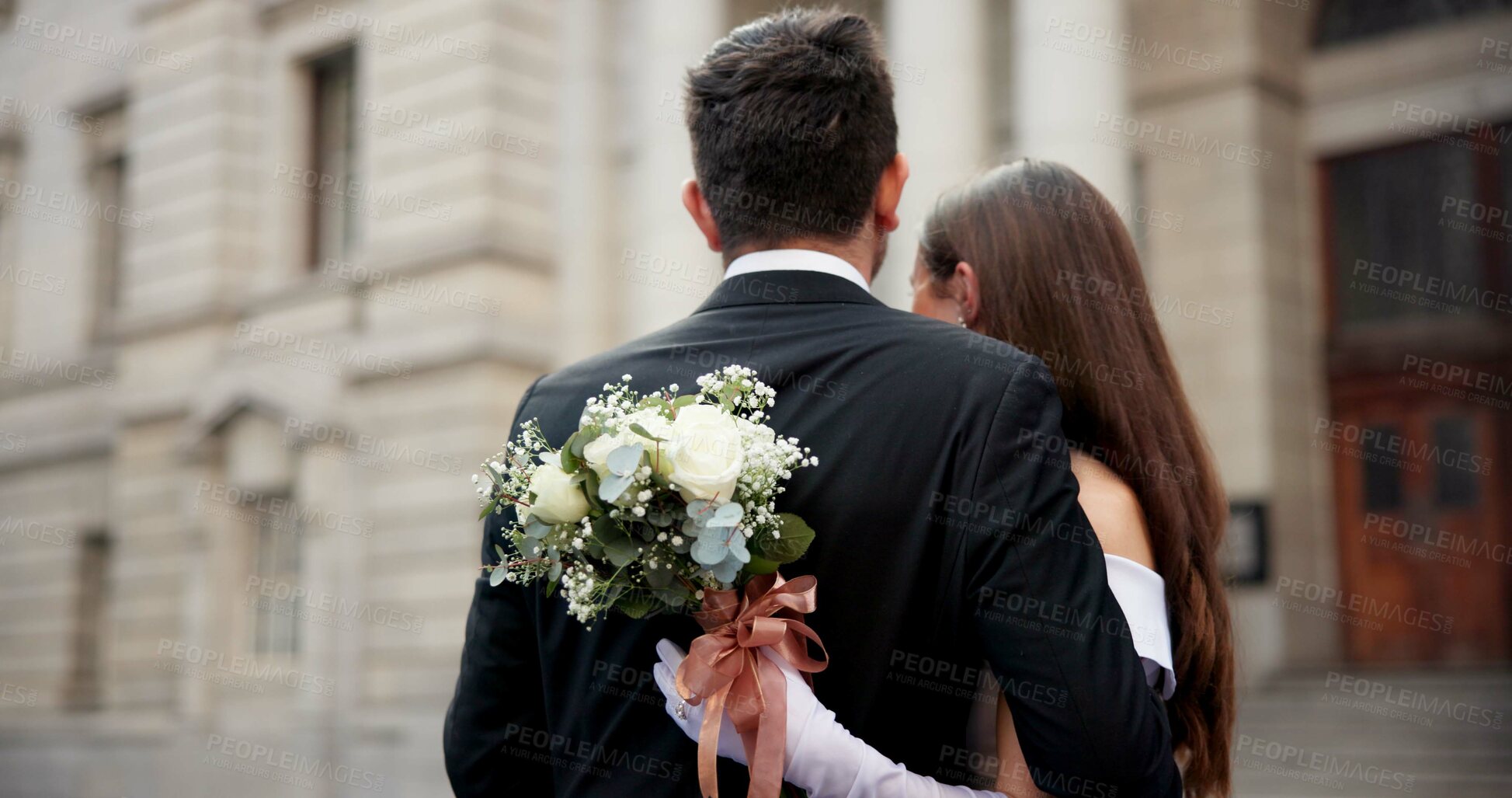 Buy stock photo City, flowers and couple at wedding with embrace, love and bride with groom in street together from back. Urban romance, man and woman at court marriage with commitment, bouquet and outdoor hug.