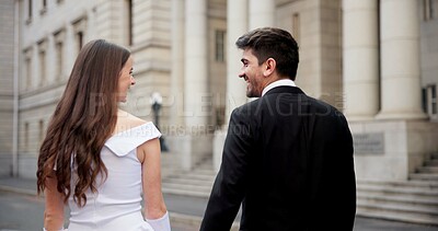 Buy stock photo City, building and couple at wedding with walking, love and bride with groom in street together from back. Urban romance, man and woman with court marriage, commitment and happy outdoor celebration.