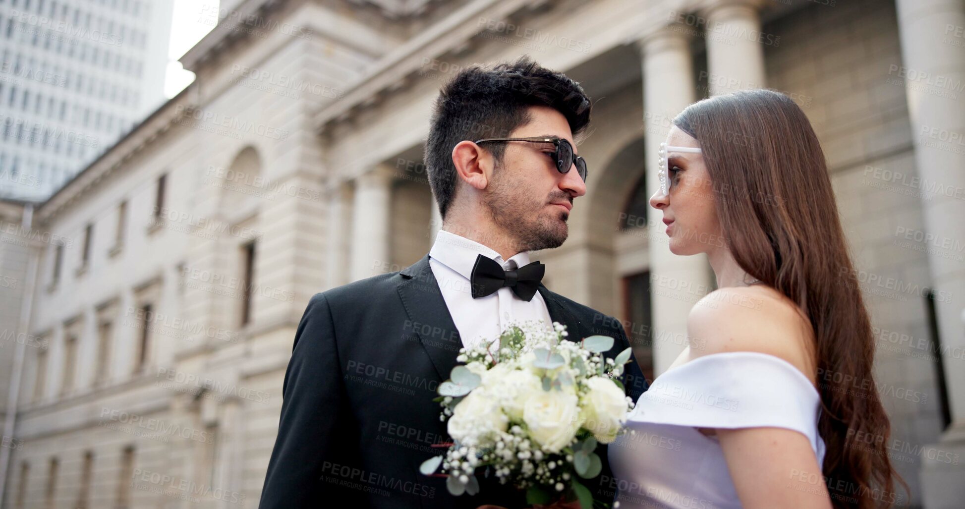 Buy stock photo Wedding, fashion and couple in city for love at marriage ceremony, celebration and event. Romance, affection and man and woman embrace for commitment, partnership and promise for court certificate