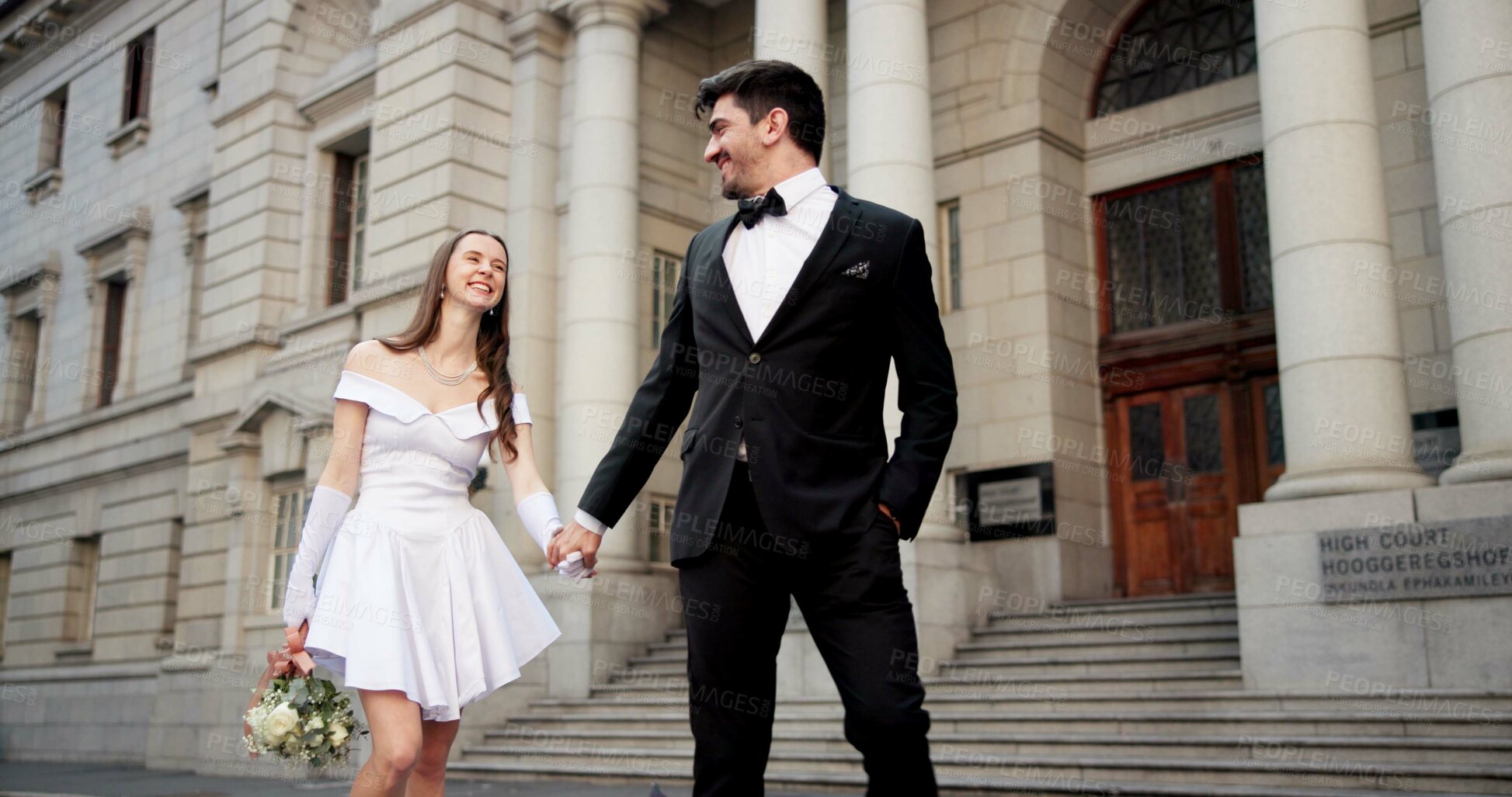 Buy stock photo Wedding, holding hands and couple in city for love at marriage ceremony, celebration and union at court. Romance, bride and groom and man and woman in town for commitment, partnership and promise