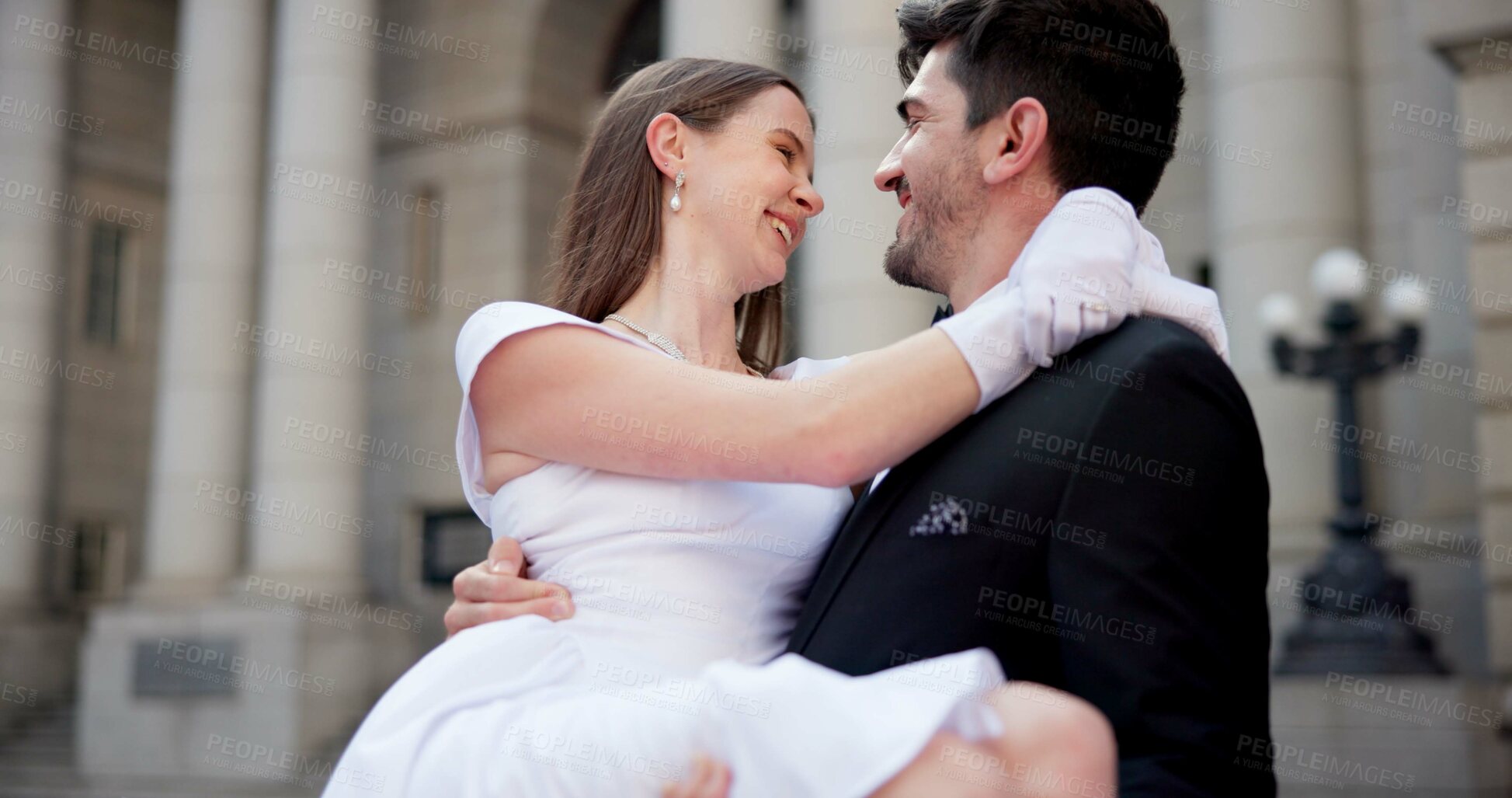 Buy stock photo Wedding, carrying and couple in city for love at marriage ceremony, celebration and court certificate. Romance, bride and groom and man and woman in town for commitment, partnership and promise