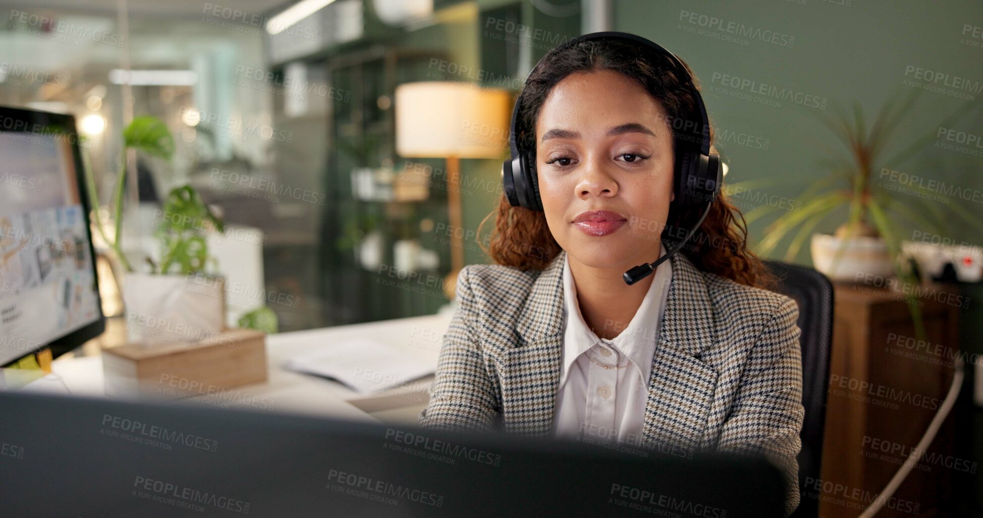 Buy stock photo Woman, call center and reading with computer at night, headphones and mic for customer support in office. Person, agent and consultant with voip, contact or overtime with telemarketing at workplace