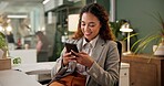 Phone, search and woman in office with smile, connection and reading online post at desk for networking. Scroll, smartphone and businesswoman typing on mobile app for communication at digital agency